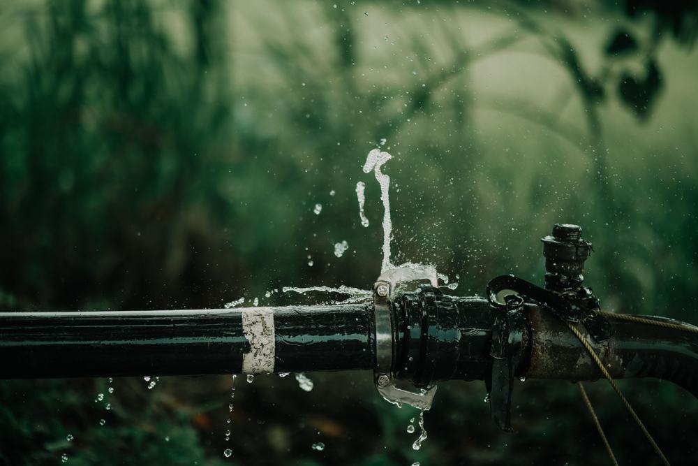 Water spraying from a leaking pipe joint